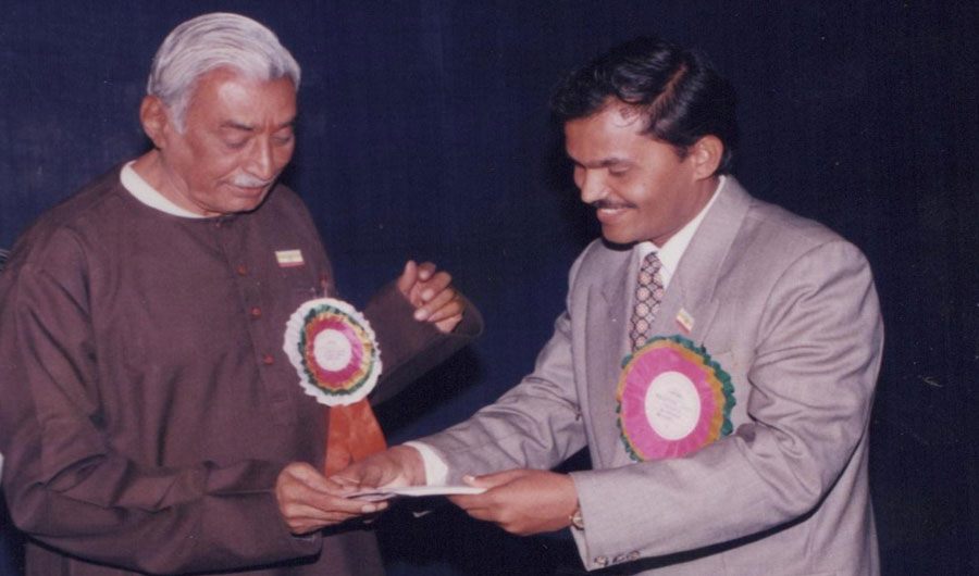 Dr. Baviskar receiving a memento